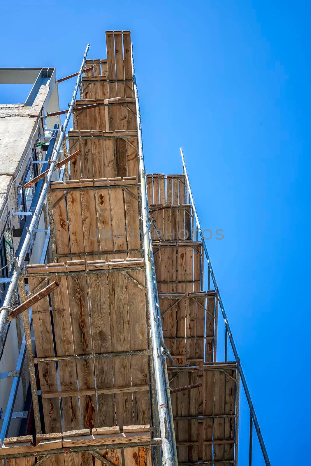 Construction site with scaffold building, scaffolding on a new building.