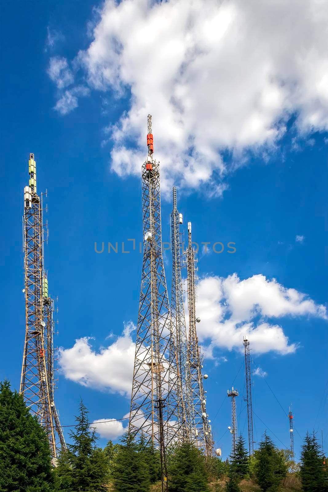 communication towers with control devices and antennas, transmitters and repeaters for mobile communications  by EdVal