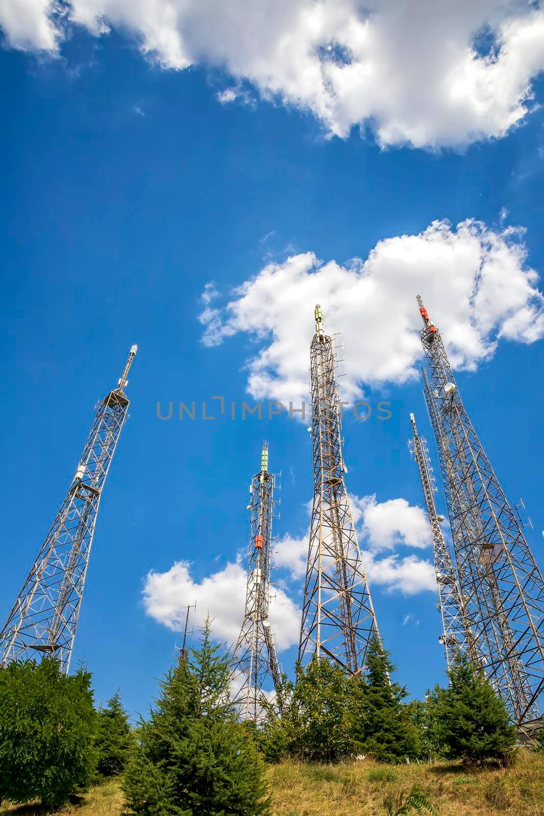 communication towers with control devices and antennas, transmitters and repeaters for mobile communications  by EdVal