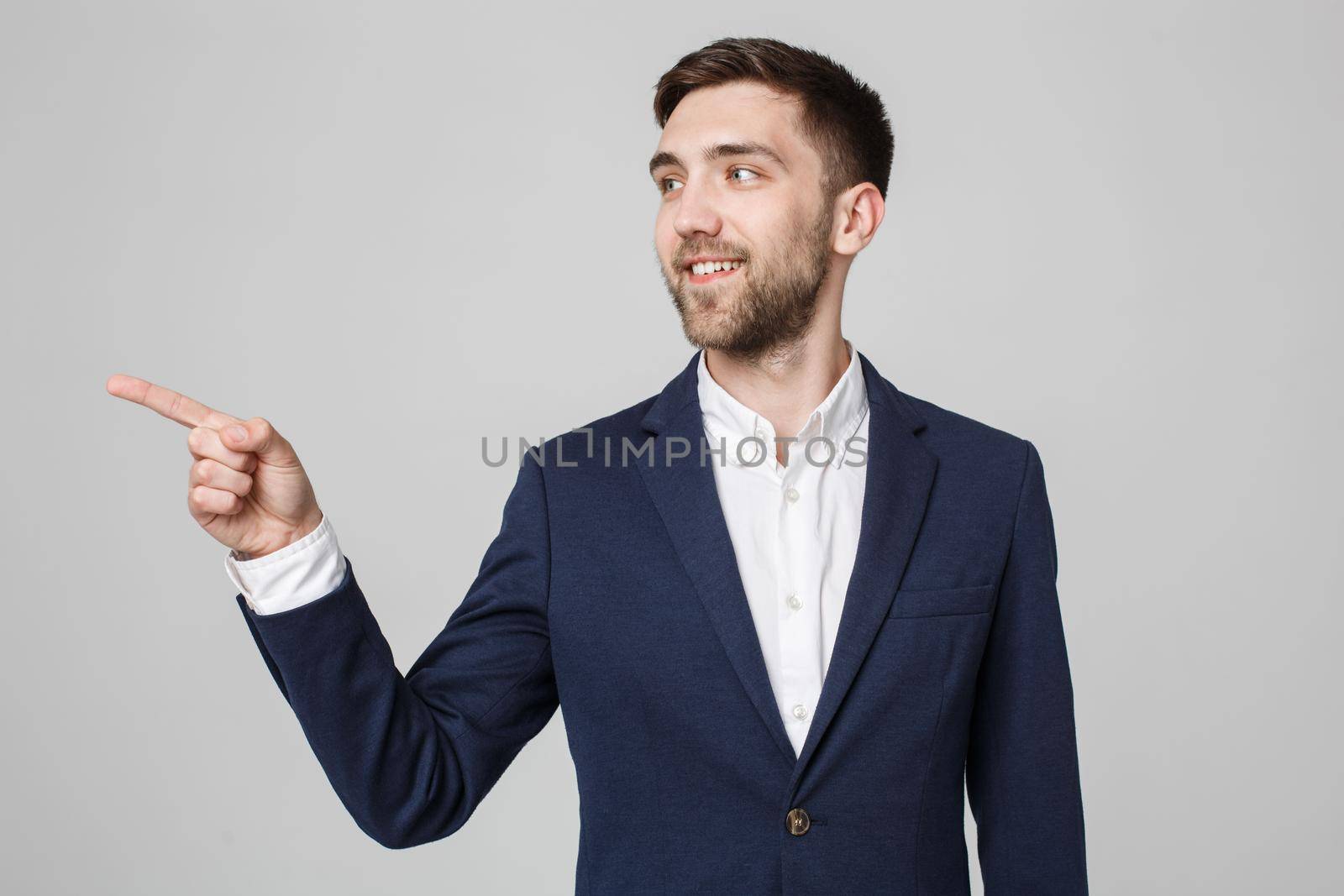 Business Concept - Portrait Handsome Business man confident smile pointing with finger. White Background.