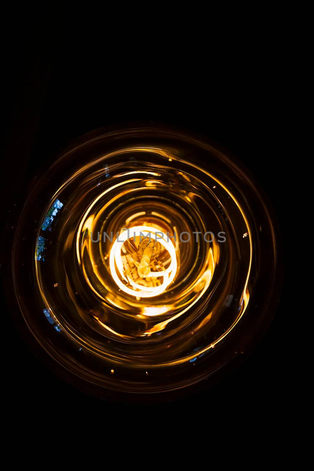 art of lighting of incandescent bulb. Close up. Vertical view by EdVal