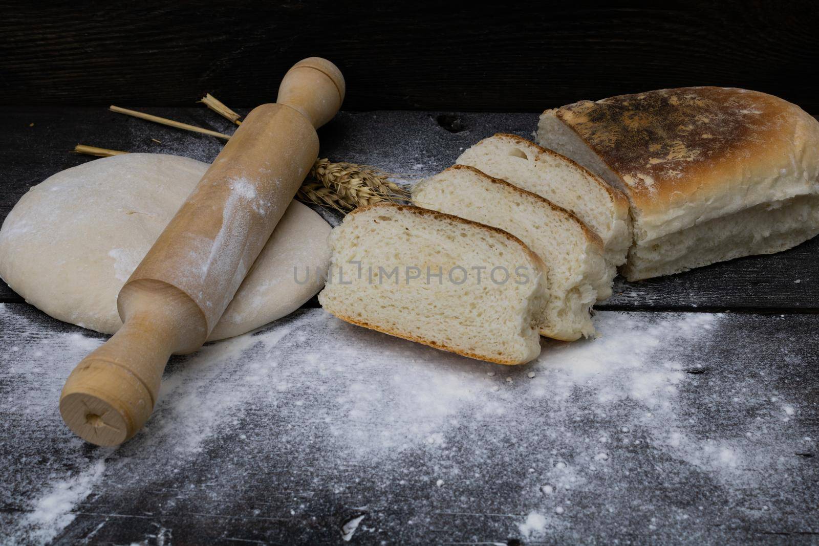 homemade bread with wheat flour on rustic wood