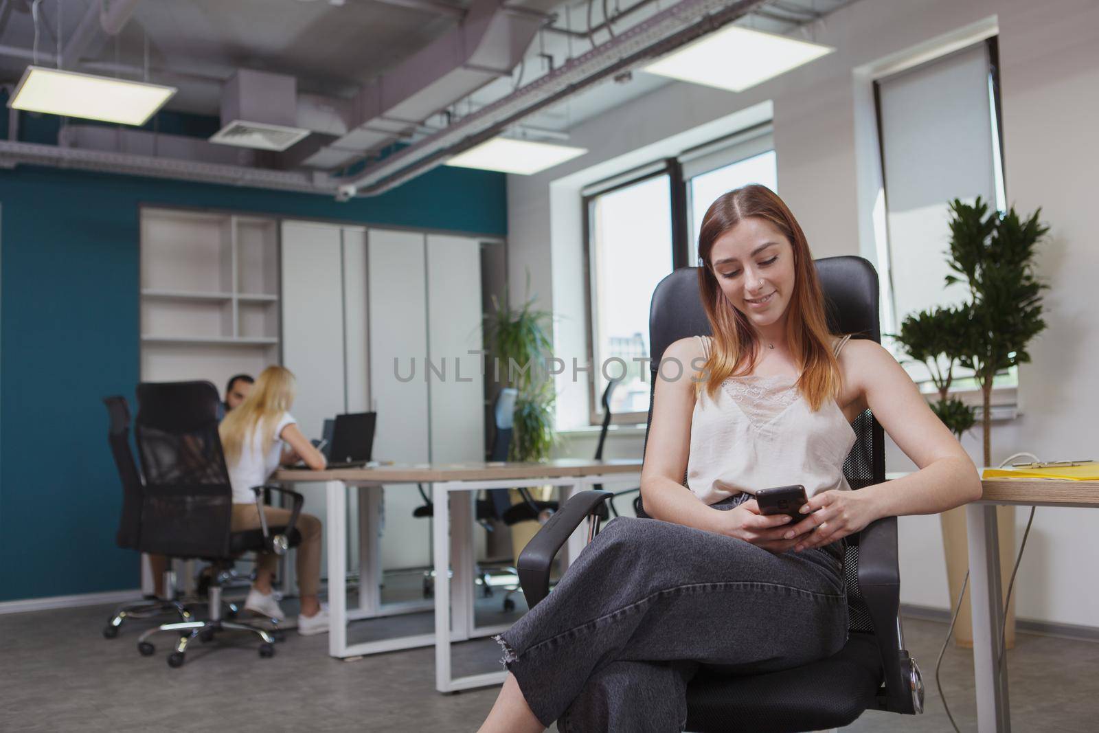 Female entrepreneur at the office by MAD_Production