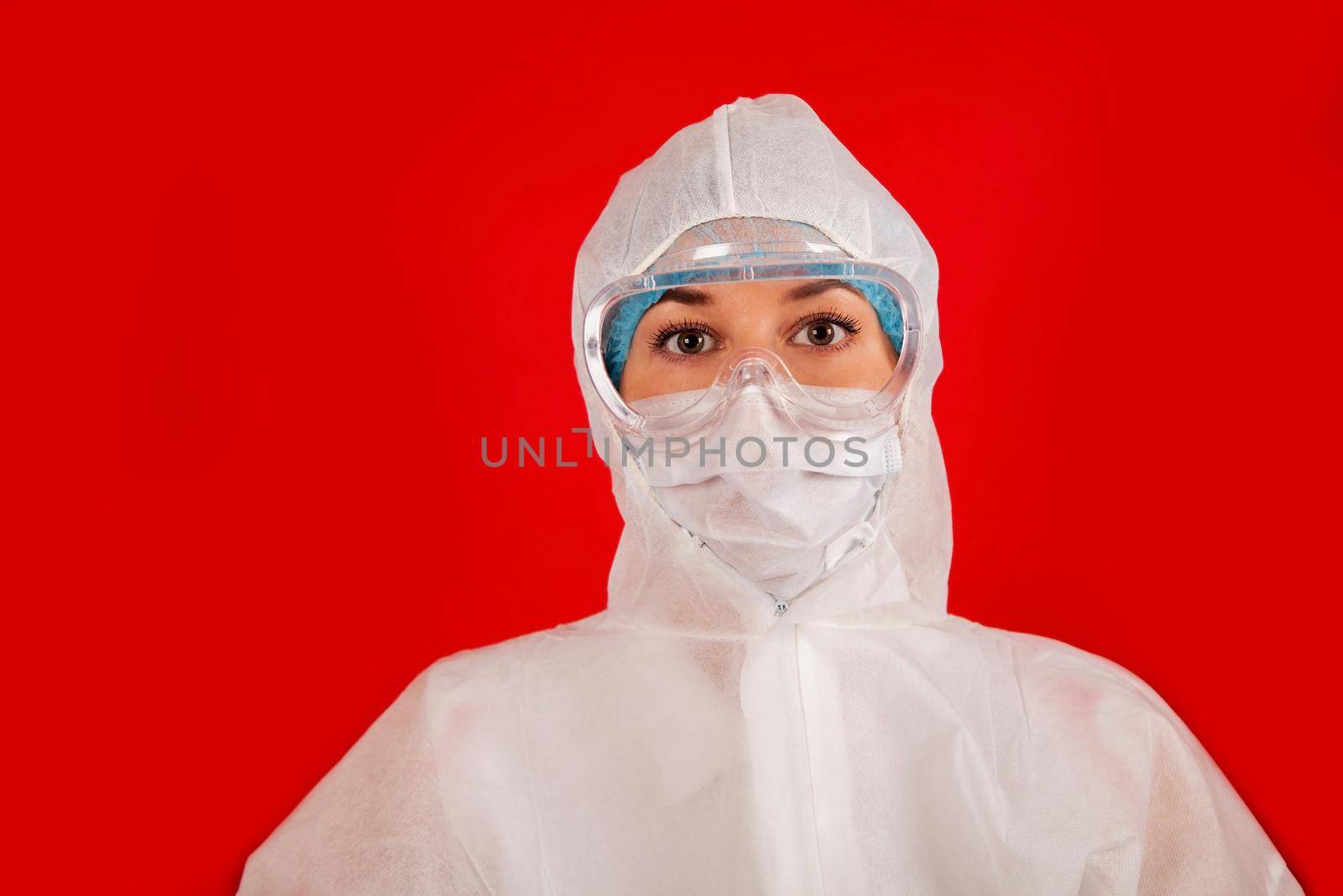 Doctor woman in a protective suit against coronavirus. Medical staff, preventive equipment. Doctor woman in a protective suit against coronavirus. Medical staff, preventive equipment