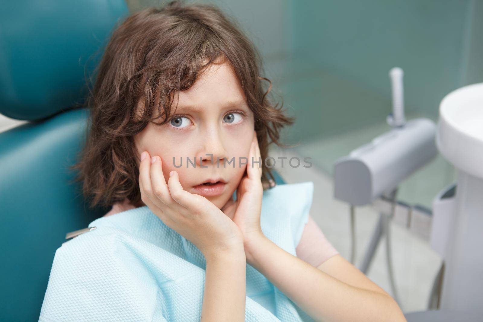 Young boy getting dental treatment by MAD_Production