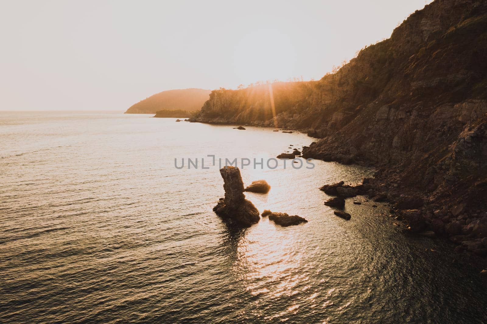 Aerial top evening view drone above Adriatic sea in Montenegro. panoramic marine mountain sunset by AndriiDrachuk