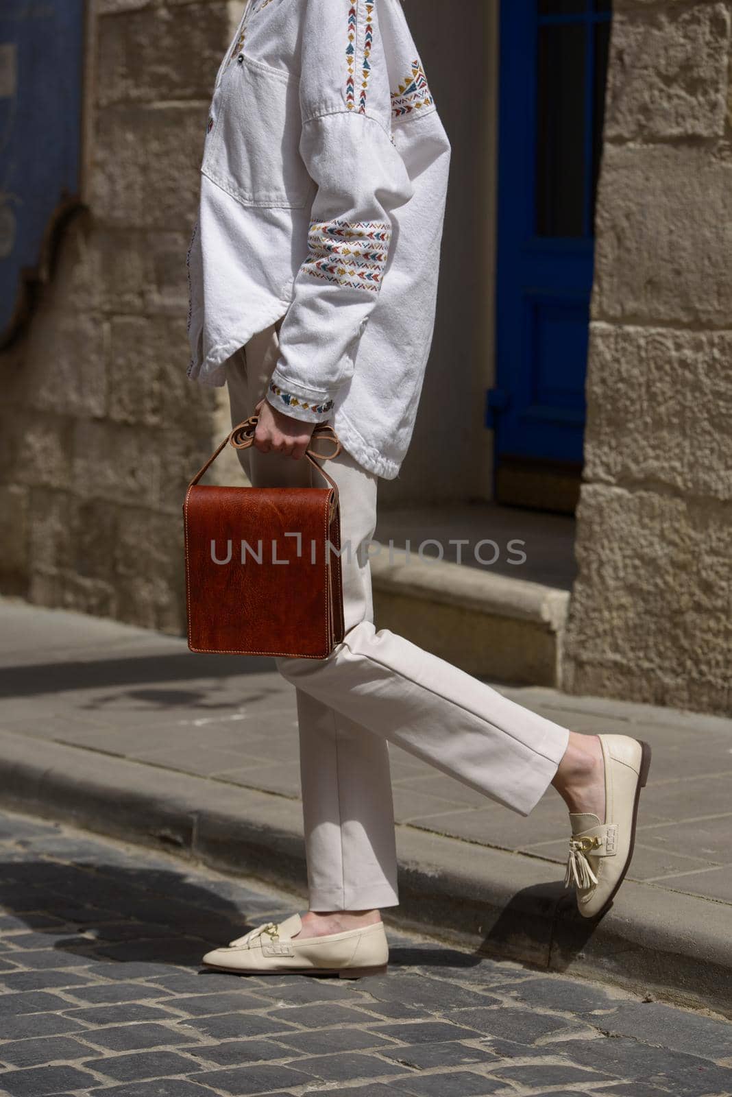 photo of a woman with a small orange leather bag. by Ashtray25