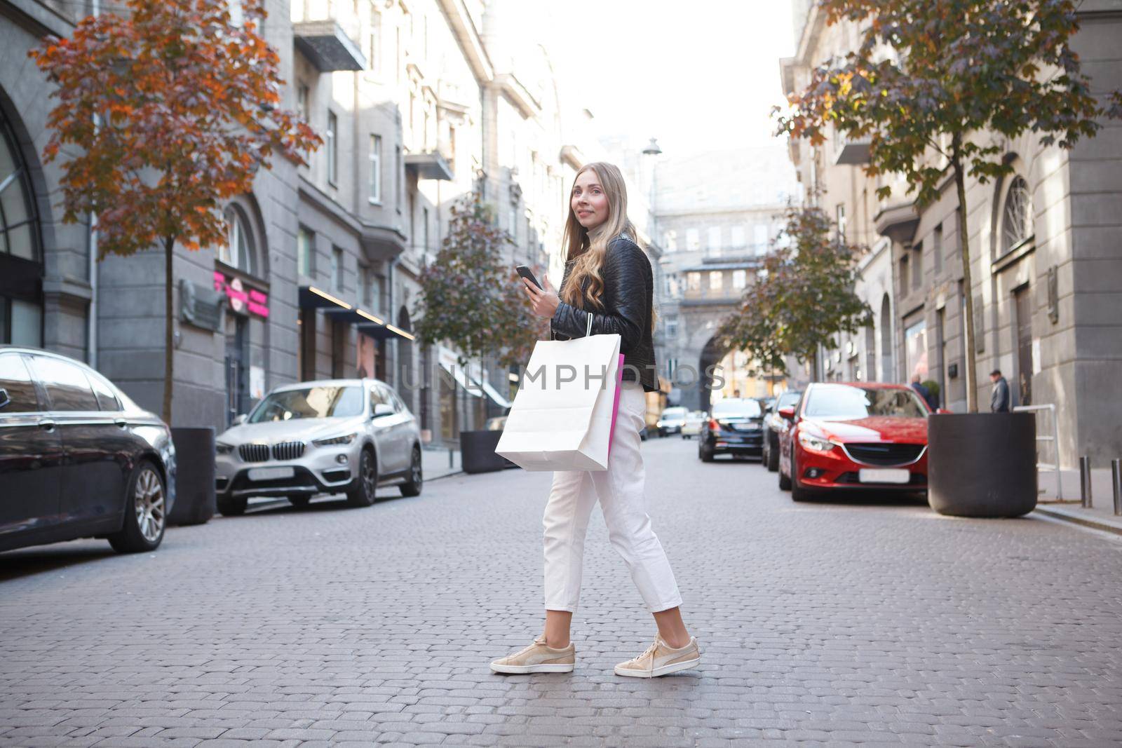 Woman with Shopping bags in the City by MAD_Production