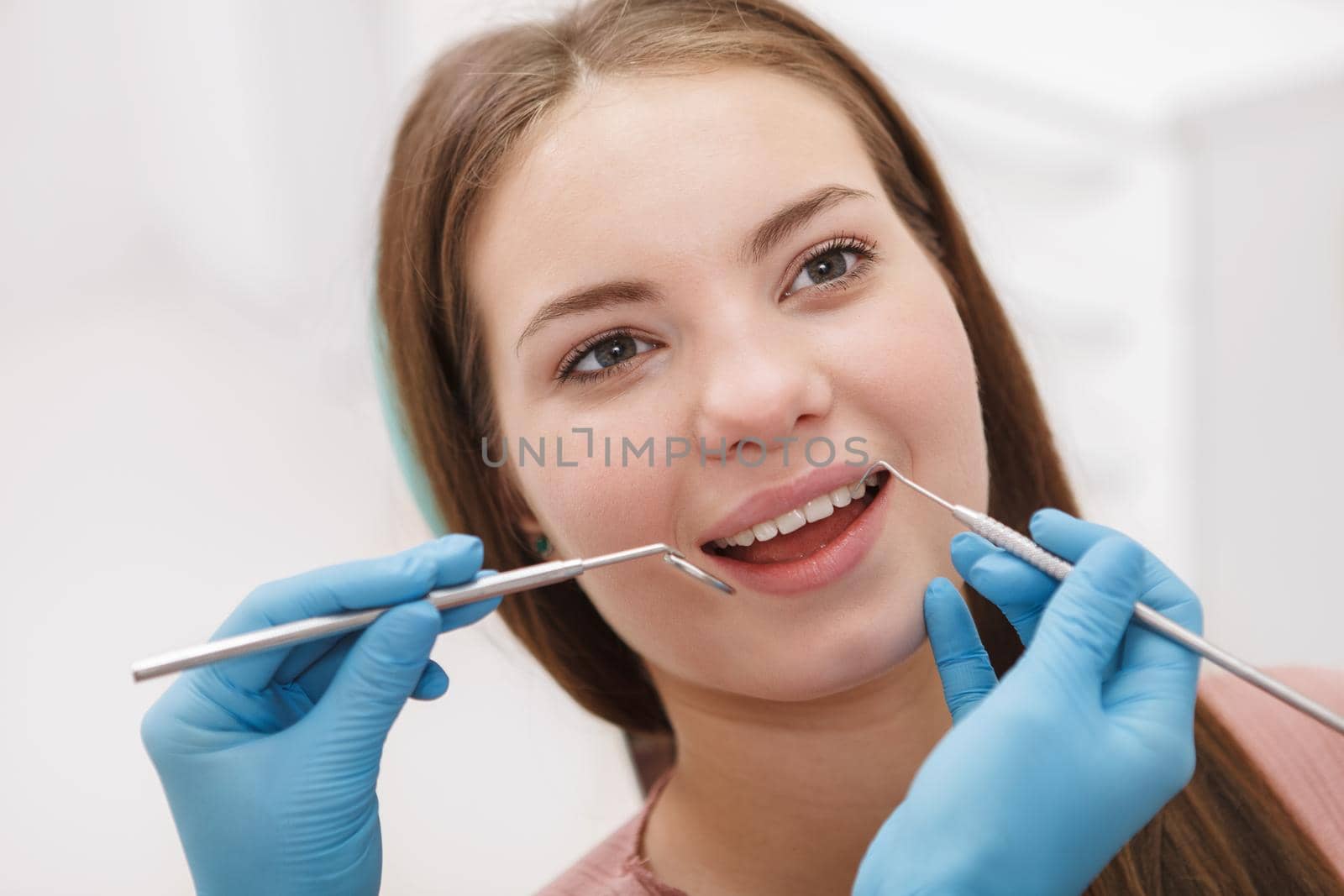 Close up of a woman smiling during dental examination at the clinic