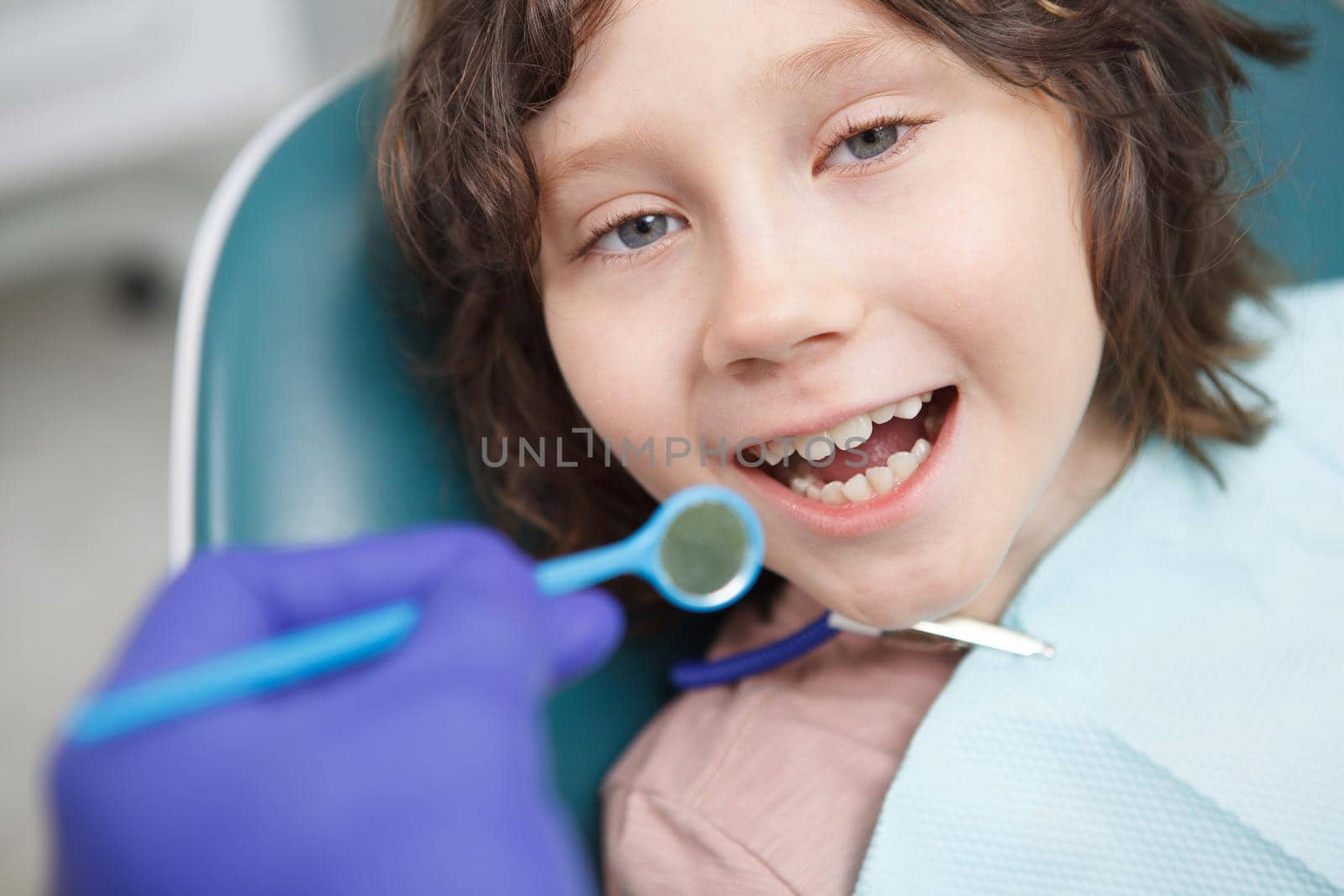 Cropped close up pov shot of little boy having dental examination