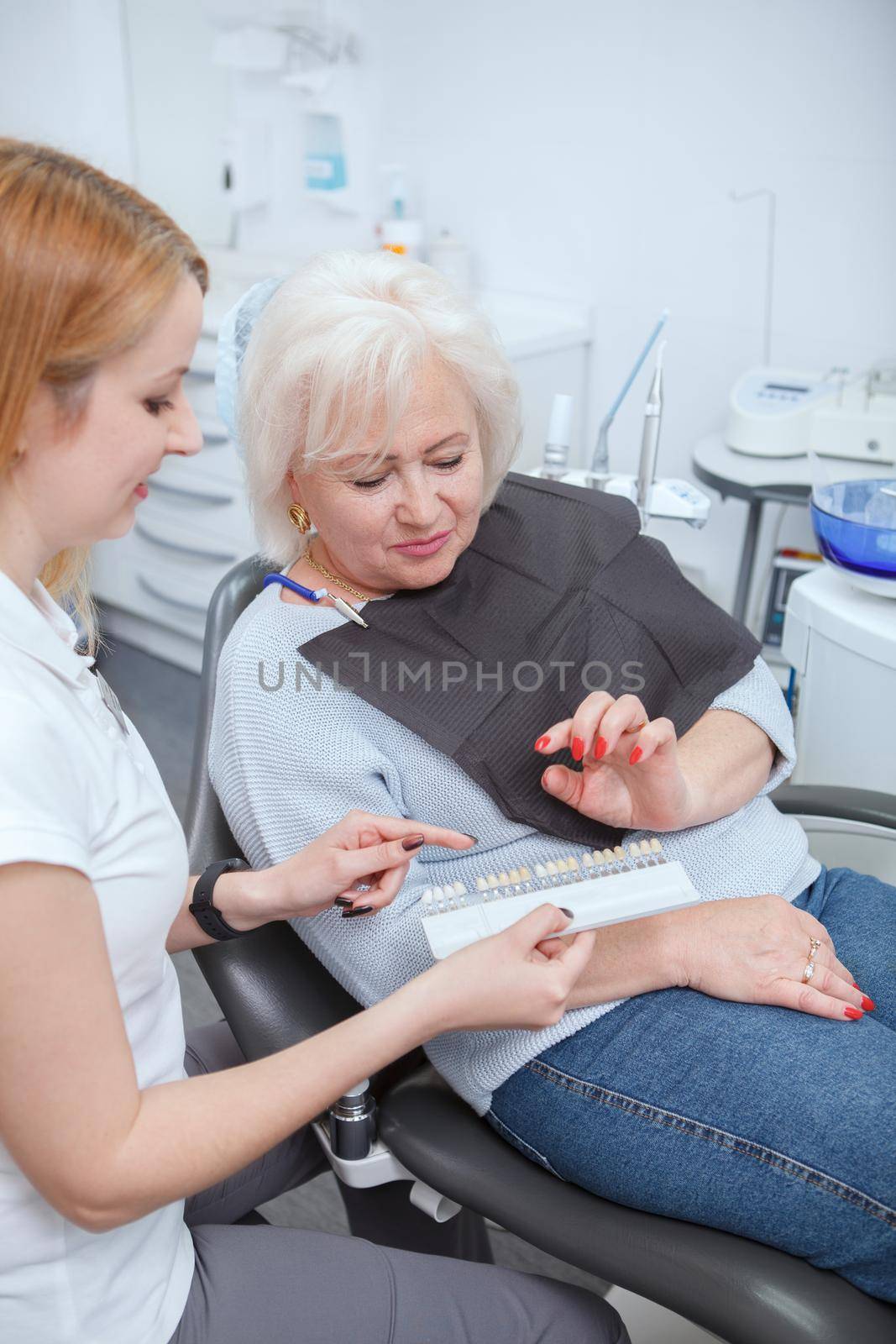 Vertical shot of a senior woman preparing to get teeth whitening at her dentists office