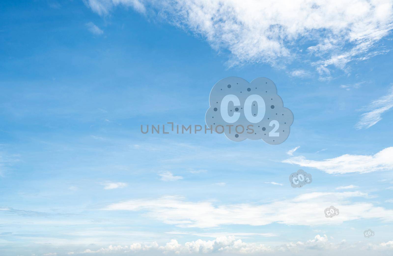 CO2 symbol on blue sky and white clouds. CO2 emissions. Greenhouse gas. Carbon dioxide gas global air climate pollution. Environment issue. Background for carbon capture and storage technology.