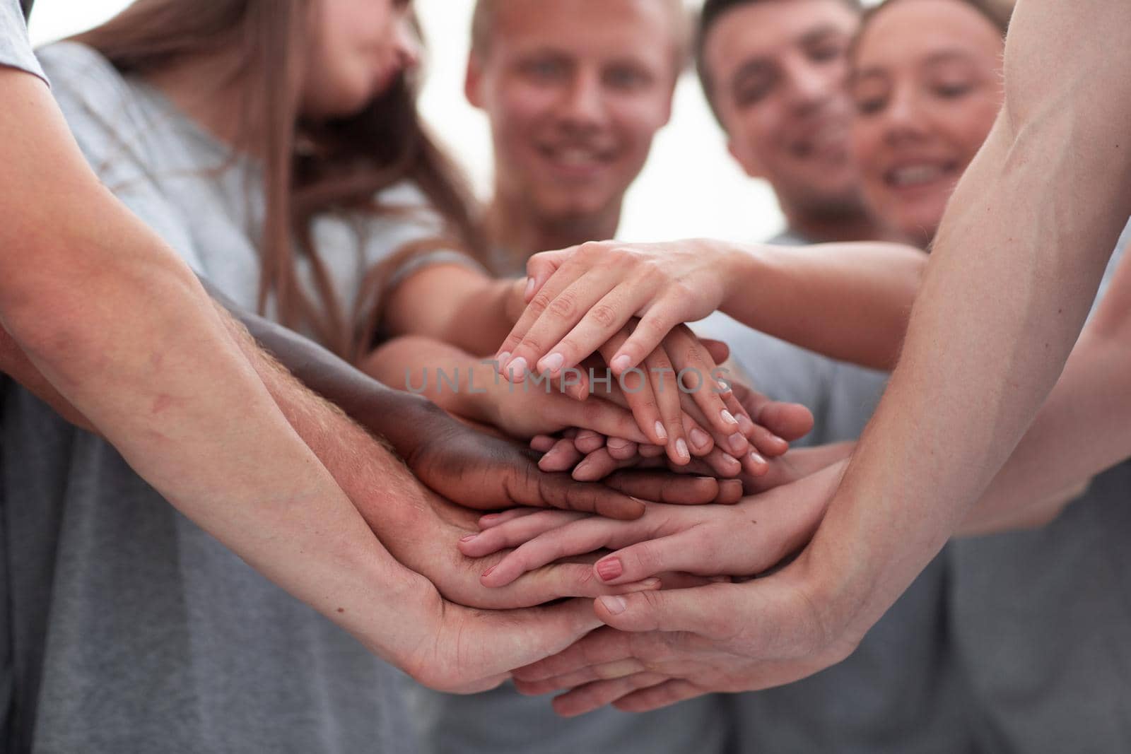 close up. a large stack of hands . the concept of unity