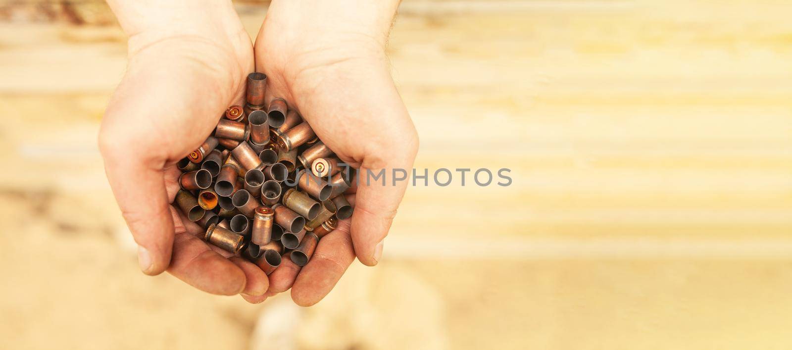 Bullet casings after a shot from military cartridges in the hands of a military soldier.