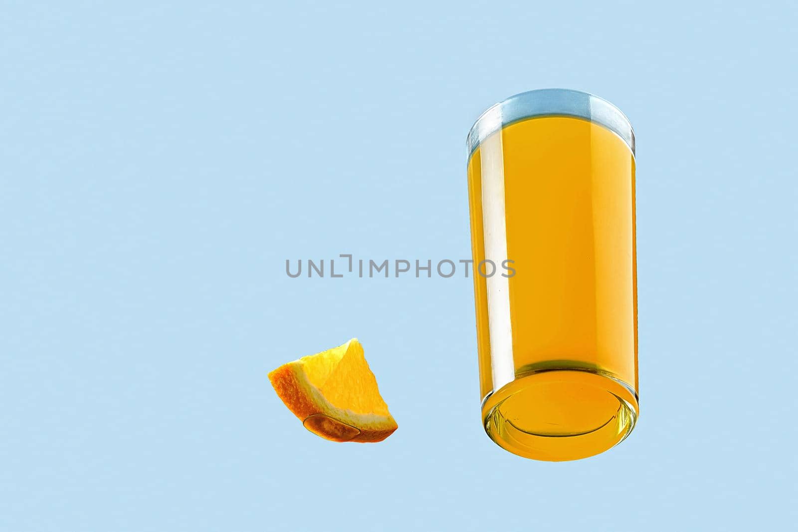 Bright summer orange tropical cocktail in a glass. Bottom view.