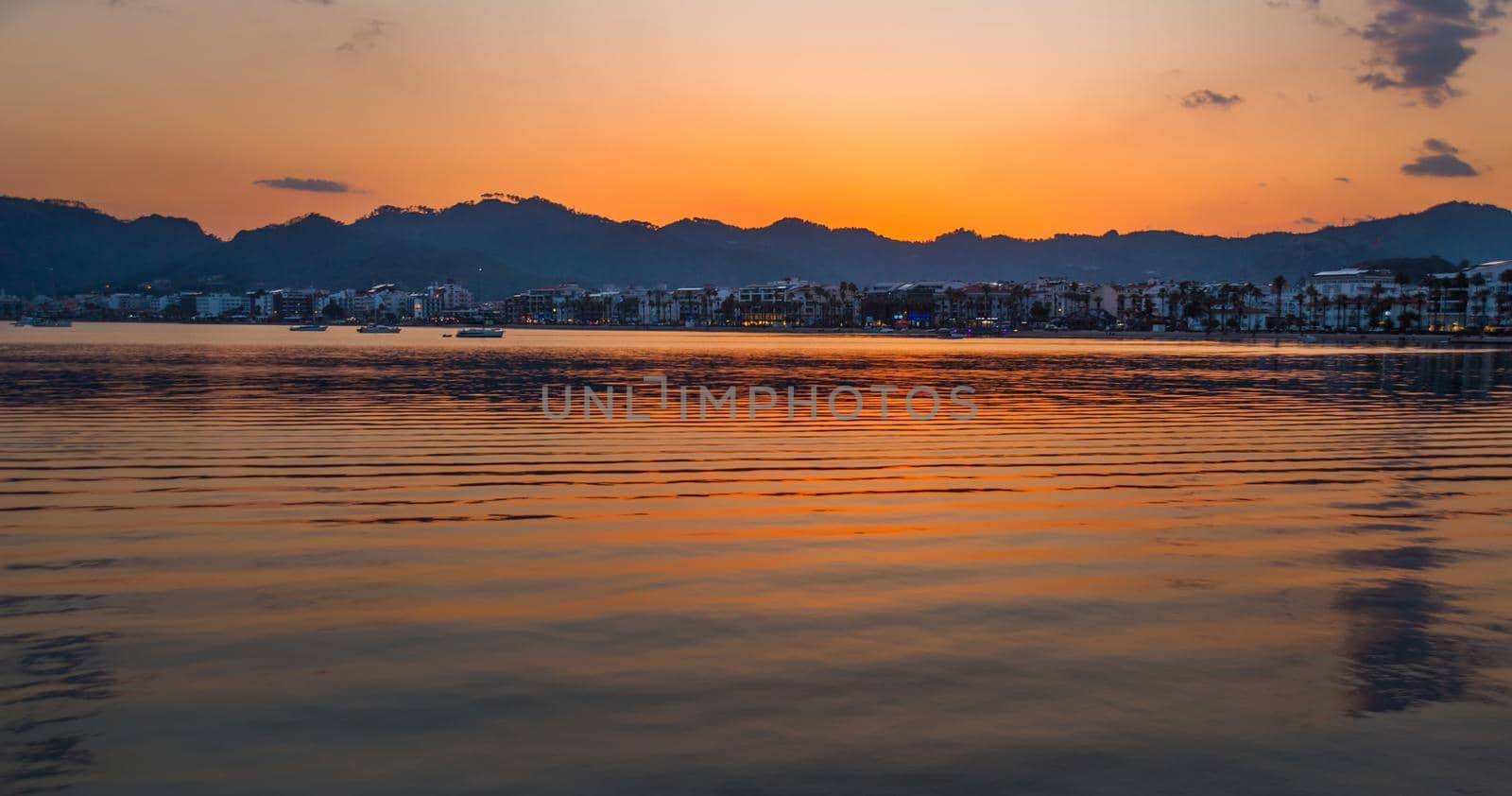 MARMARIS, MUGLA, TURKEY: Beautiful landscape with a view of the sea and the town of Marmaris at sunset.