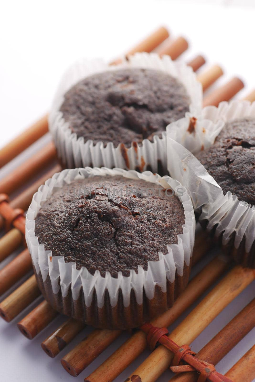 close up of chocolate muffin on table .