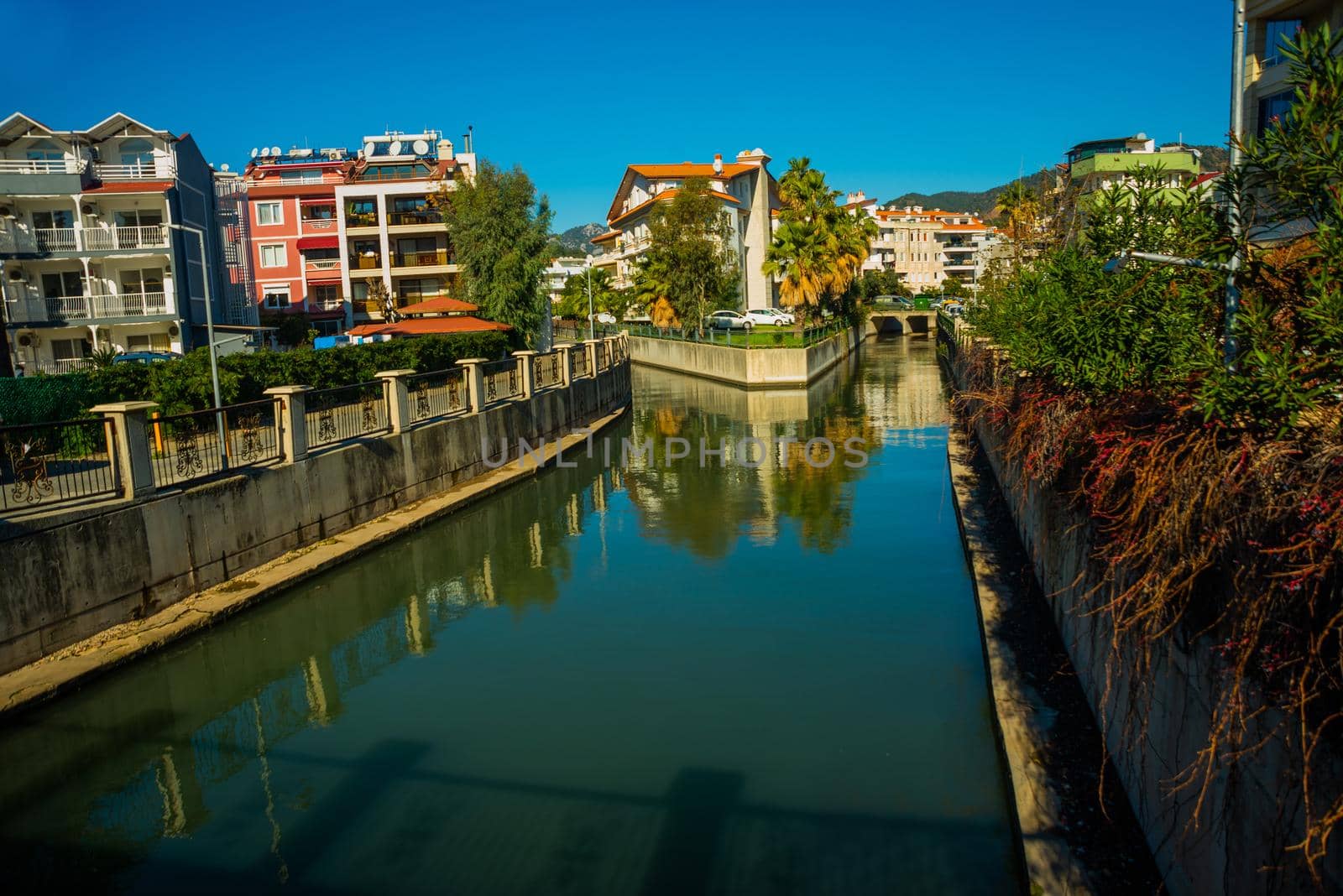 MARMARIS, MUGLA, TURKEY: Canal with water on the street of the city of Marmaris on a sunny day.
