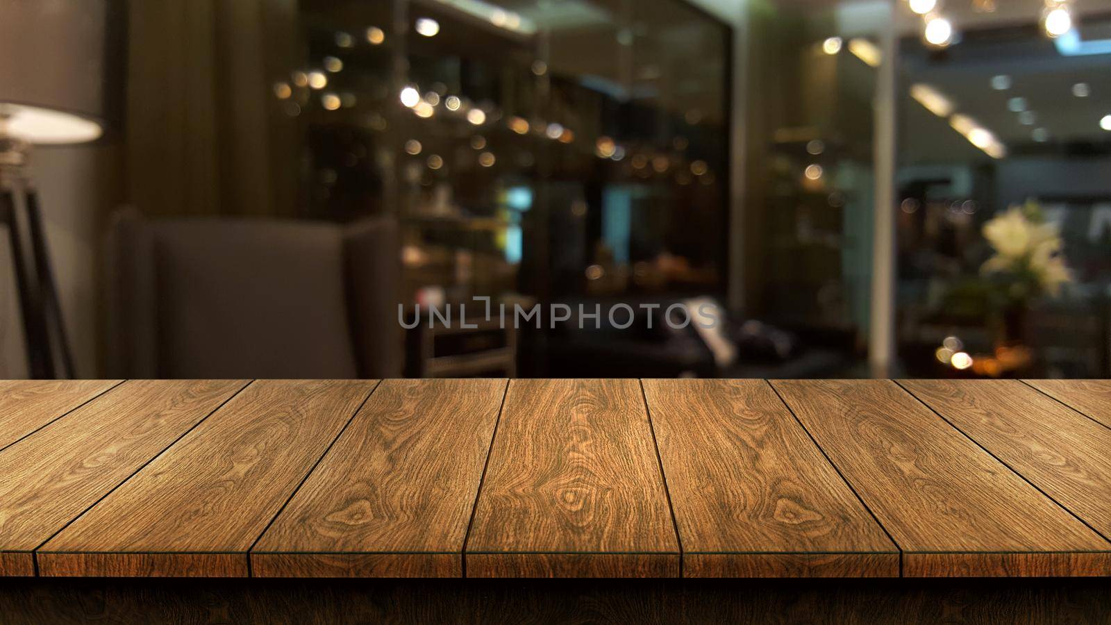 Wood table in blur background of modern restaurant by biancoblue