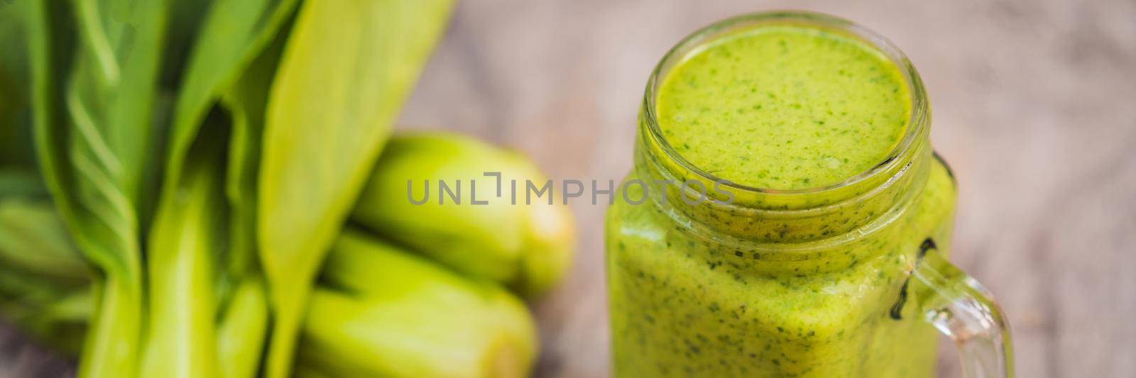 Ginger green apple smoothie on concrete background. It can be used as a background. BANNER, LONG FORMAT