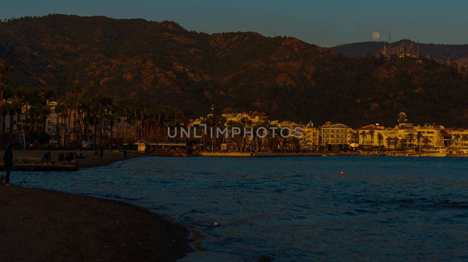 MARMARIS, MUGLA, TURKEY: Landscape with a view of the old town, Fortress and ships in Marmaris at sunset.