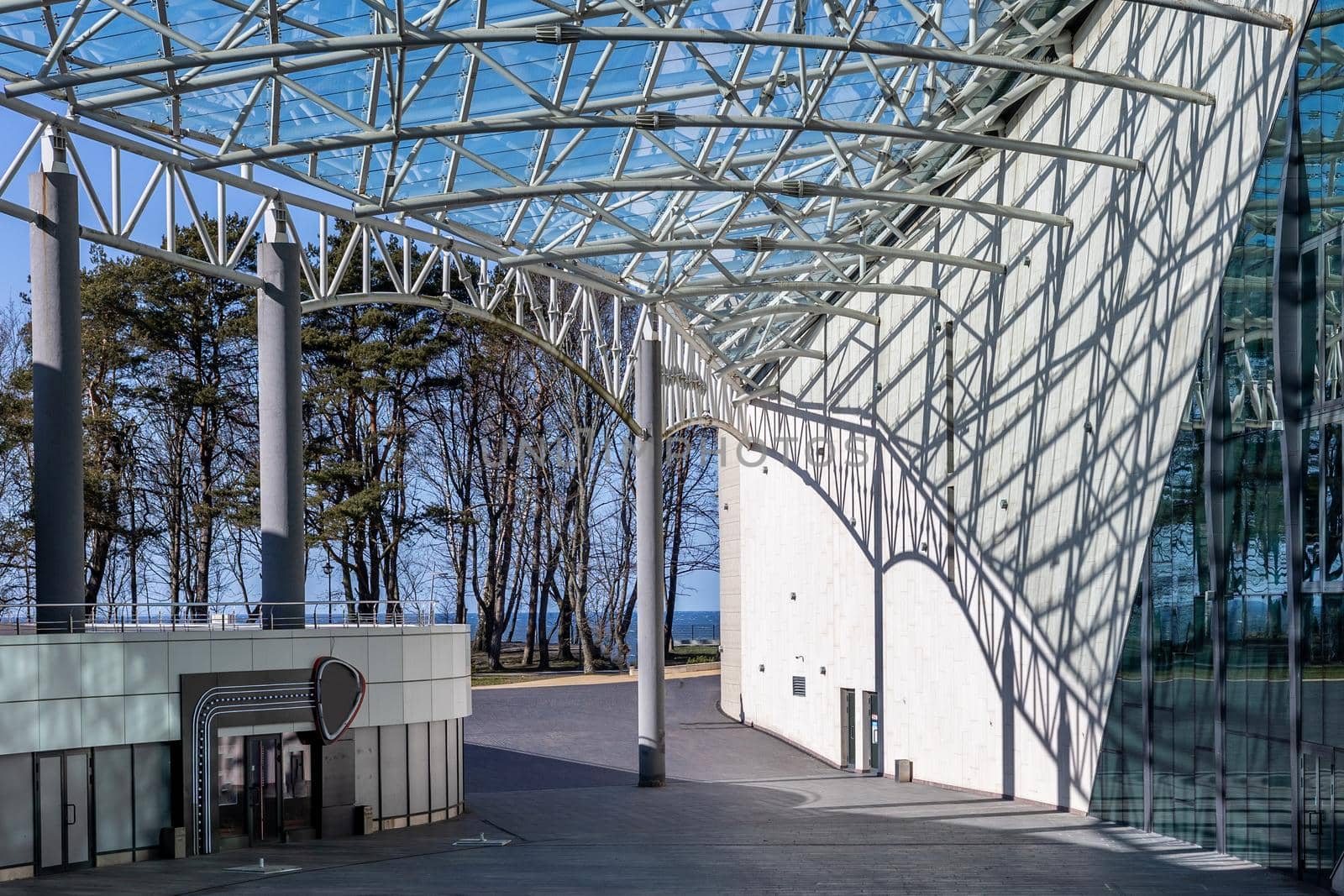 The sun penetrates through the glass roof of a large building and casts a beautiful shadow. Concert Yantar Hall in Svetlogorsk Raushen, Kalinigrad region, Russia, near the Baltic sea. High quality photo.