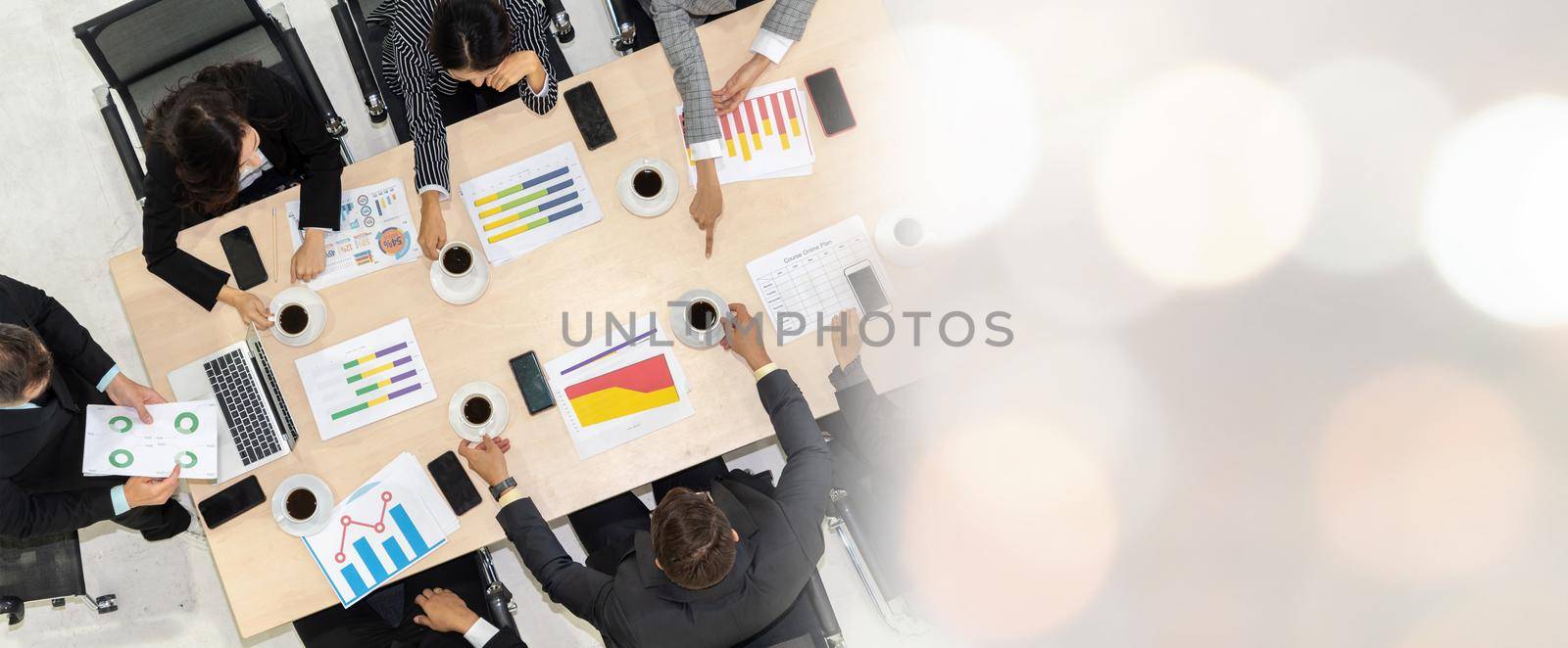 Business people group meeting shot from top view in office . Profession businesswomen, businessmen and office workers working in team conference with project planning document broaden view .