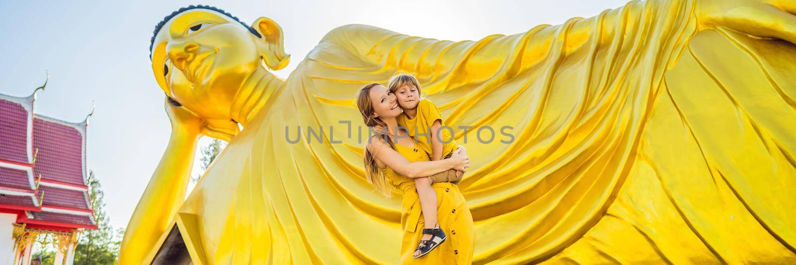 Happy tourists mother and son on background ofLying Buddha statue BANNER, LONG FORMAT by galitskaya