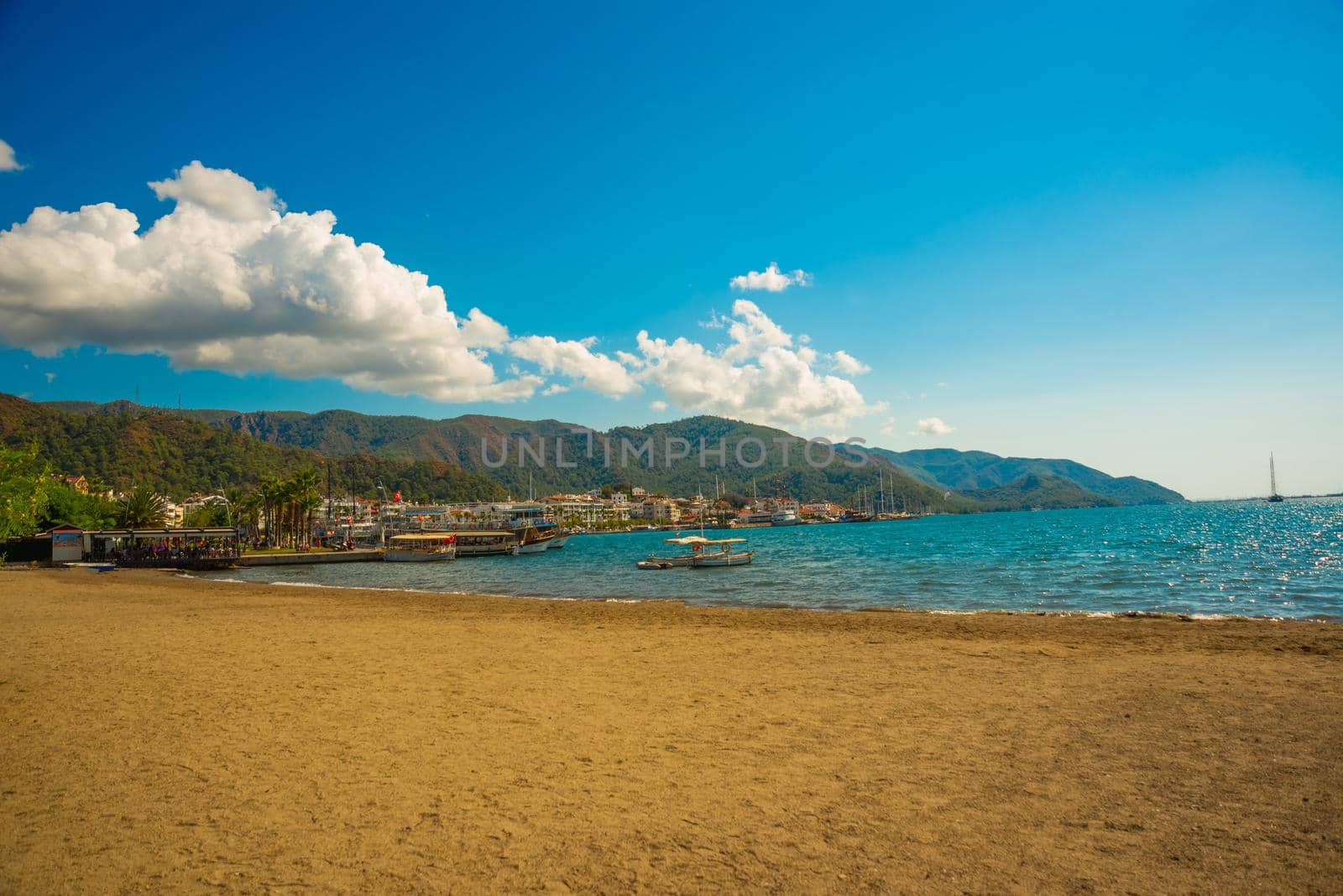 MARMARIS, MUGLA, TURKEY: Beautiful landscape with views of the beach, the Mediterranean sea and the mountains on a sunny day in the Turkish city of Marmaris.