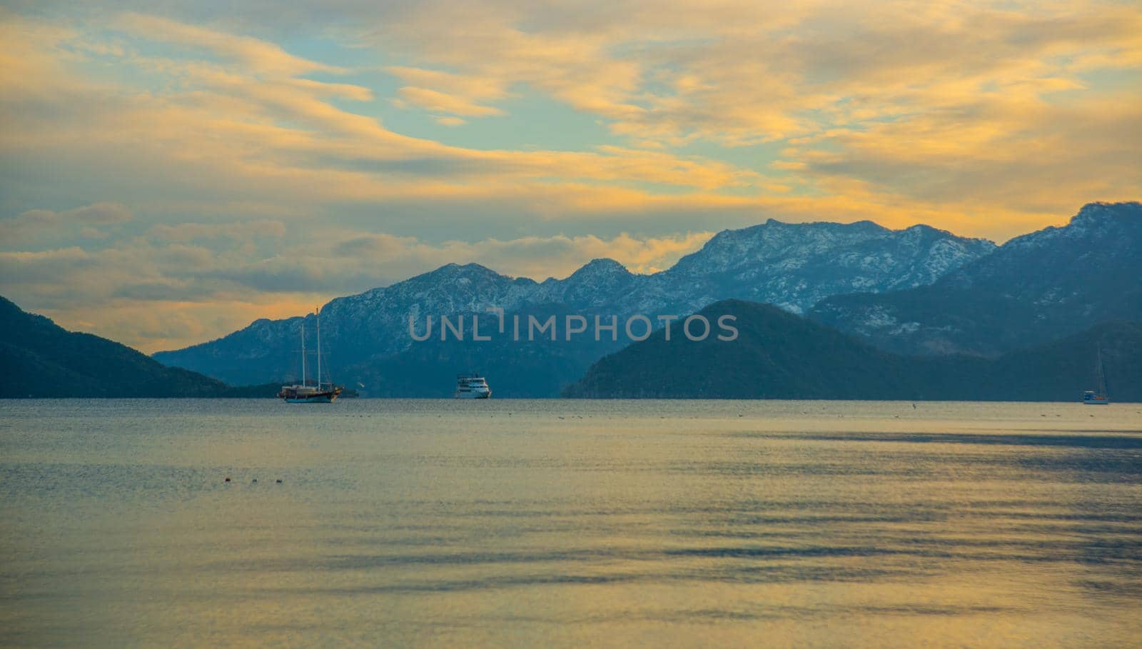 MARMARIS, MUGLA, TURKEY: View from Marmaris beach to the sea and mountains in the snow in winter.