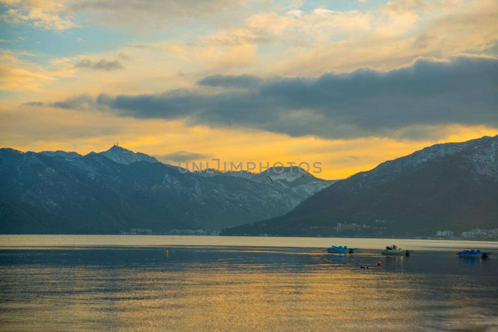 MARMARIS, MUGLA, TURKEY: View from Marmaris beach to the sea and mountains in the snow in winter.