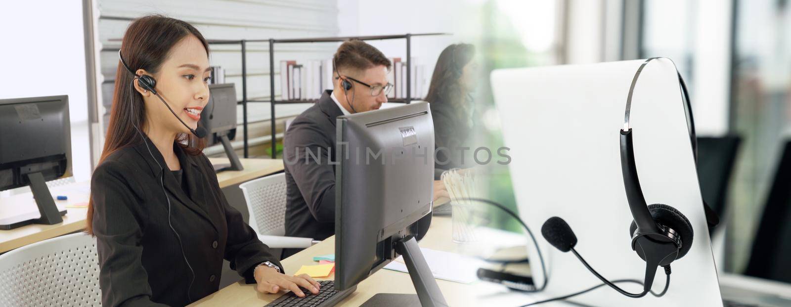 Business people wearing headset working in office to support remote customer or colleague. Call center, telemarketing, customer support agent provide service in broaden view .