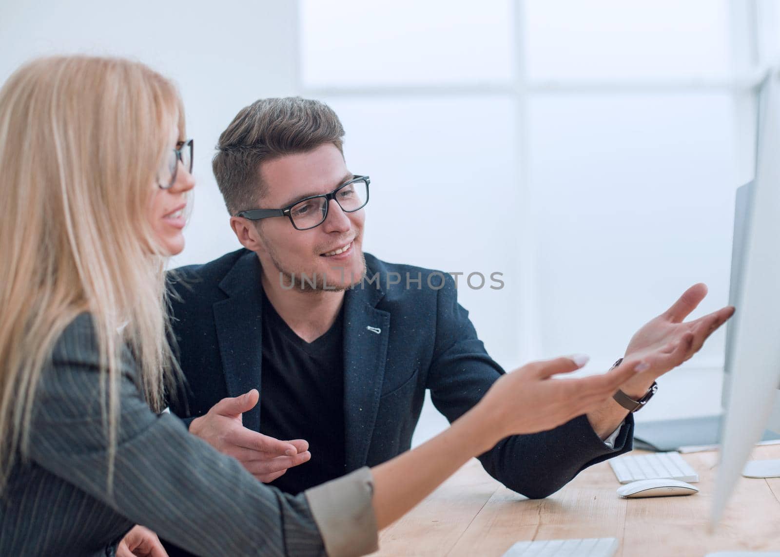 close up. two business colleagues discussing new information . people and technology