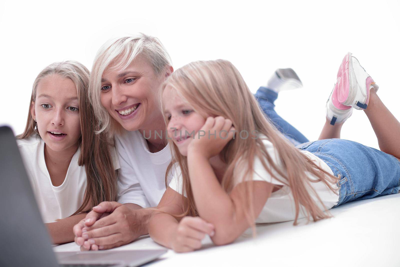 mom and daughters watching their favorite video on a laptop by asdf