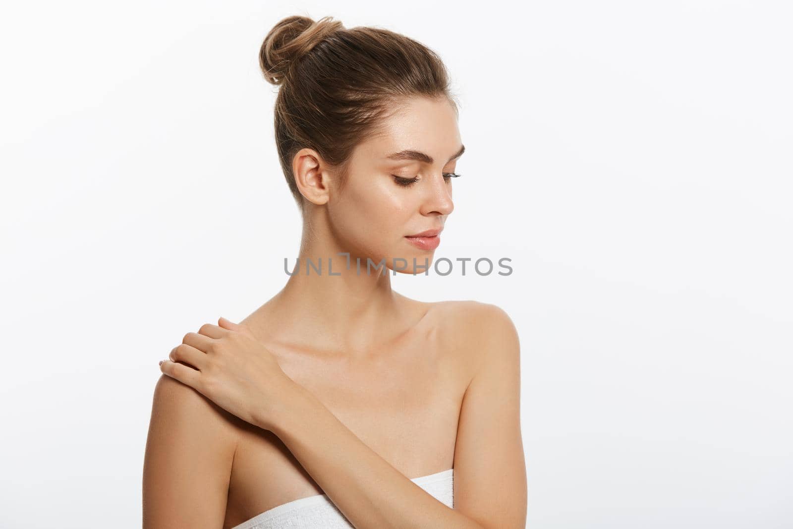 Youth and Skin Care Concept - Beauty Woman face Portrait. Beautiful model Girl with Perfect Fresh Clean Skin. Isolated on white background. by Benzoix