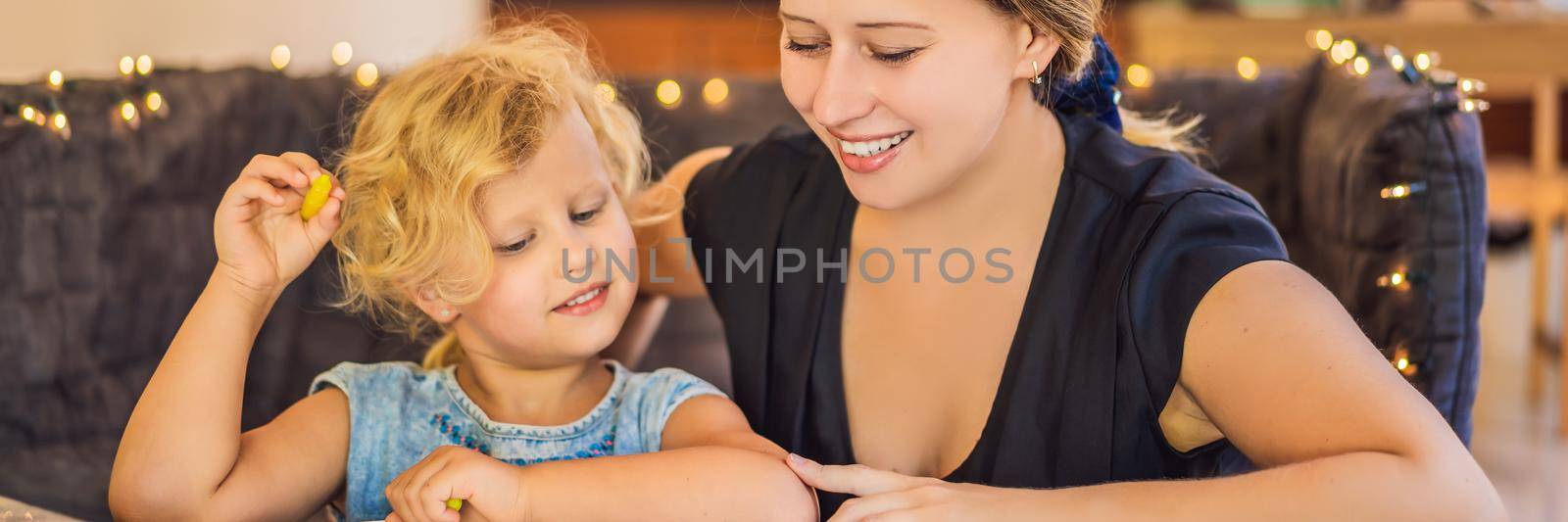A teacher, a tutor for home schooling and a teacher at the table. Or mom and daughter. Homeschooling BANNER, LONG FORMAT by galitskaya