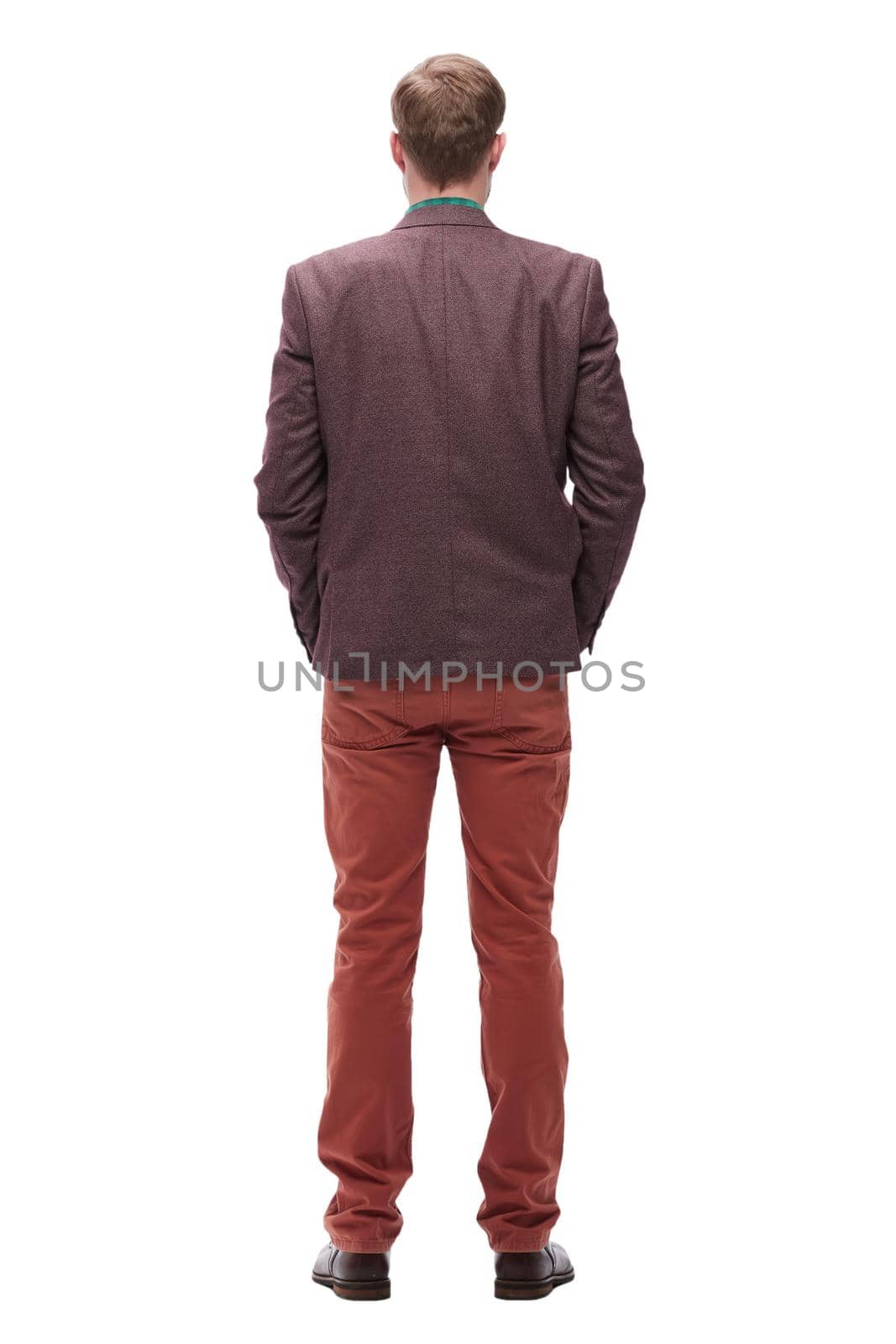 rear view. young man standing in front of white blank screen. isolated on white background