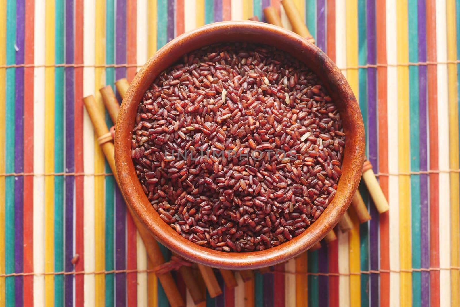 red rice in a bowl on table , haradighi rice .