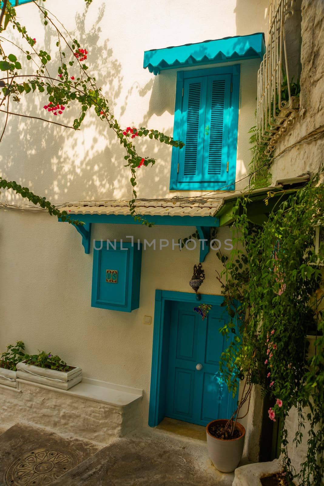 MARMARIS, MUGLA, TURKEY: Beautiful Streets of old Marmaris. Narrow streets with stairs among the houses with white brick, green plants and flowers in the old town of resort of in Turkey