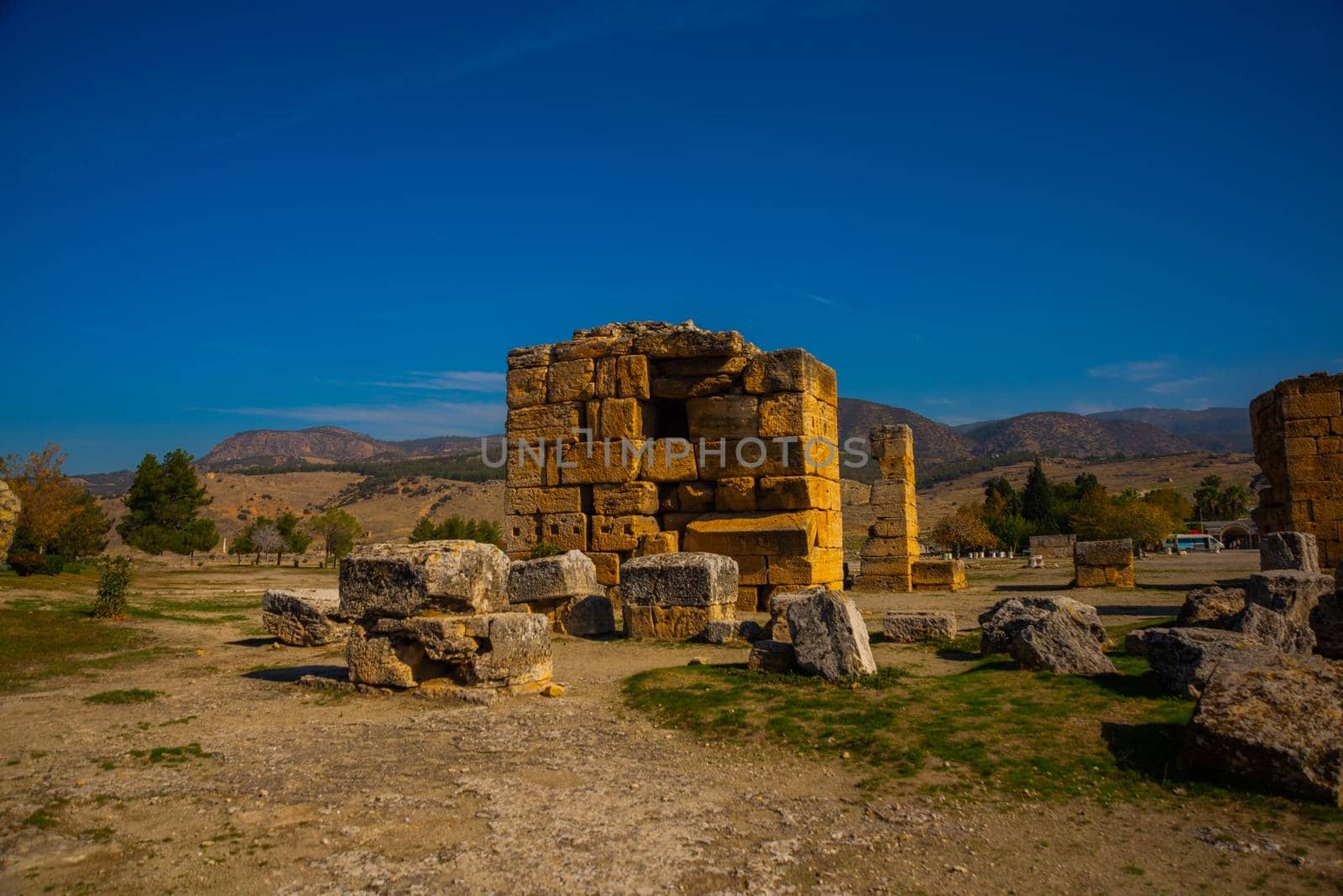 PAMUKKALE, DENIZLI, TURKEY: Ruins of the ruined city of Hierapolis in Pamukkale on a sunny day.