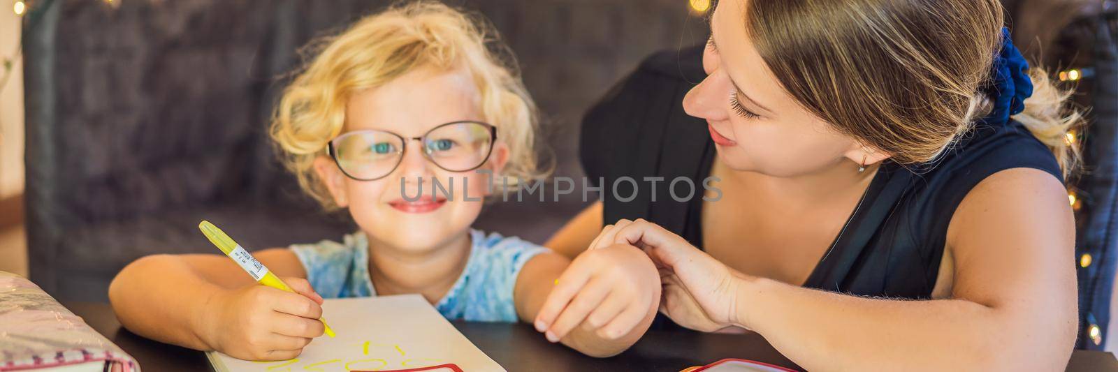 A teacher, a tutor for home schooling and a teacher at the table. Or mom and daughter. Homeschooling BANNER, LONG FORMAT by galitskaya