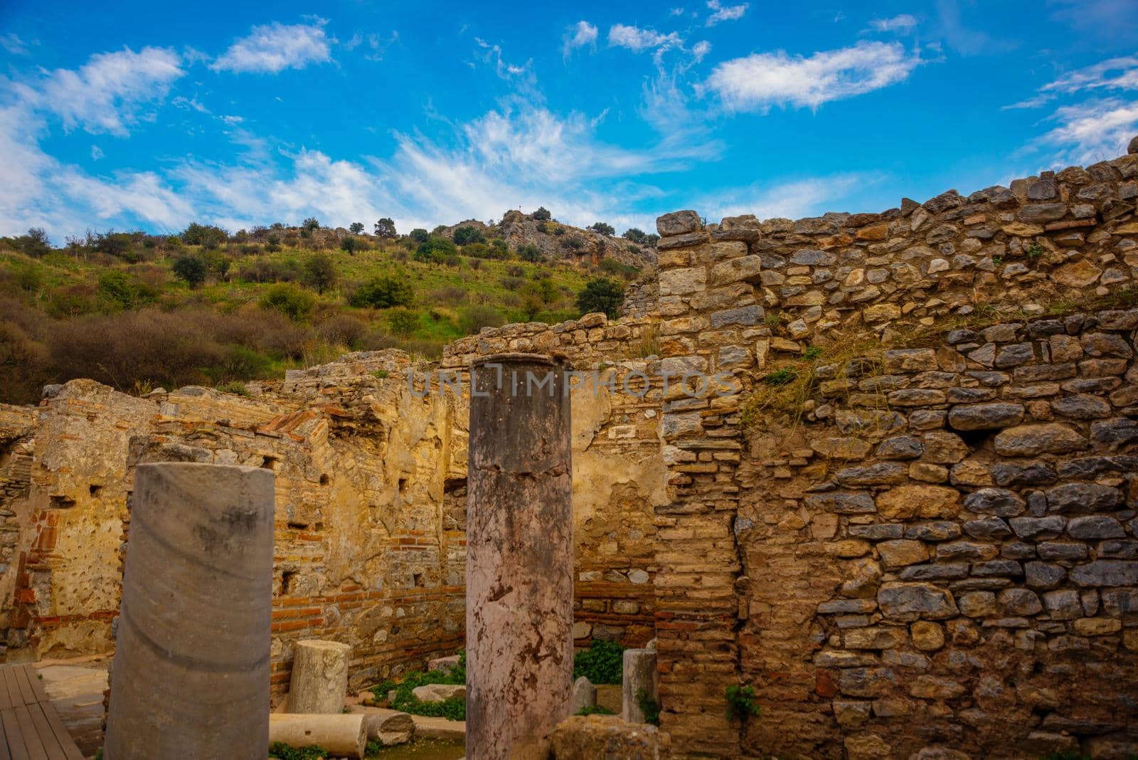 EPHESUS, TURKEY: Ruins on the street of the ancient city of Ephesus. by Artamonova