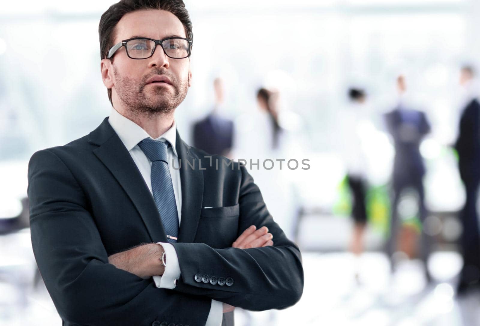 Businessman standing near the window and looking into it by asdf