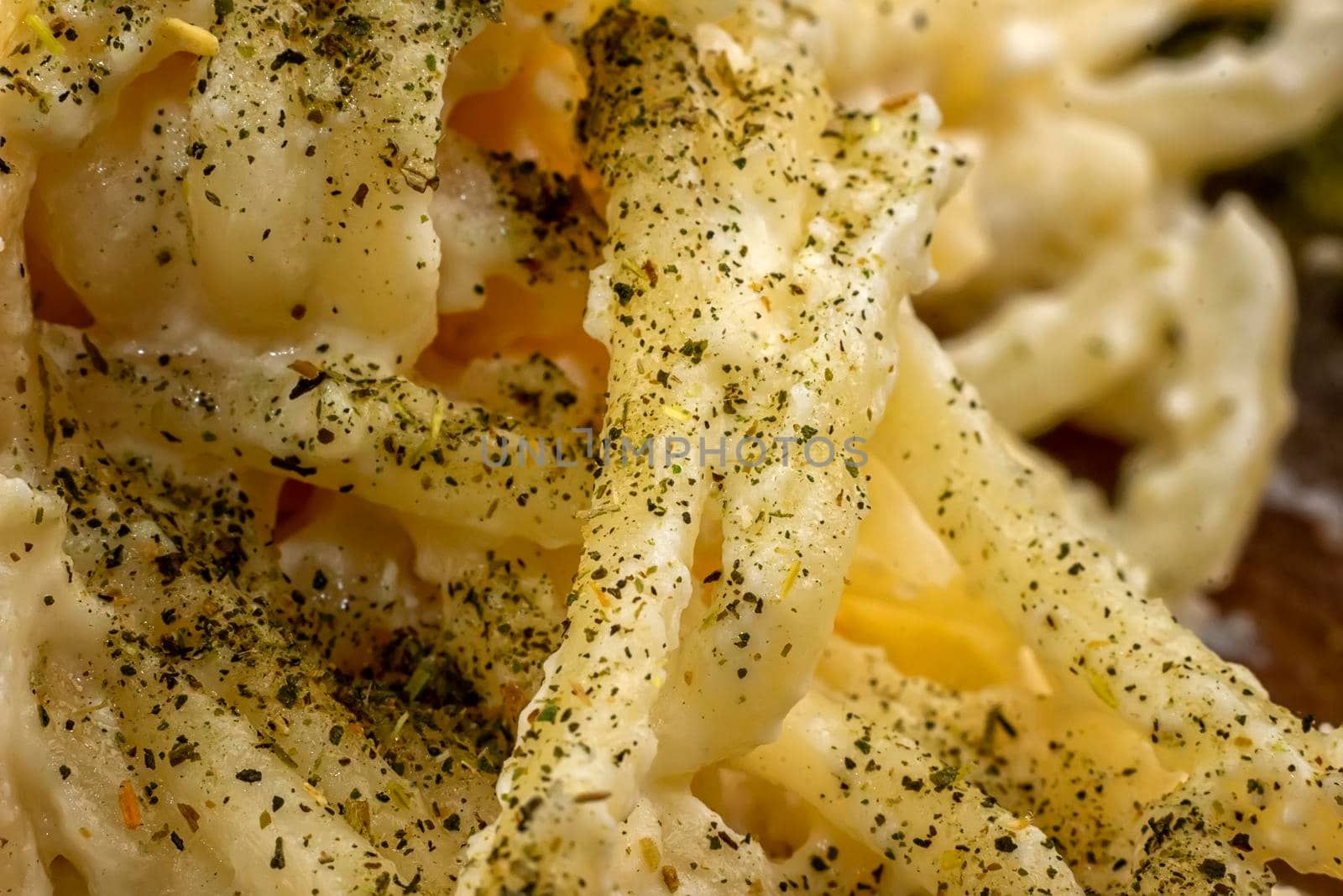 Tasty spaghetti with spices. Close up. Macro shot by EdVal