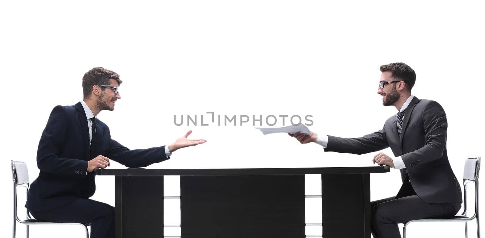 side view. two business people discussing a business document . isolated on white background