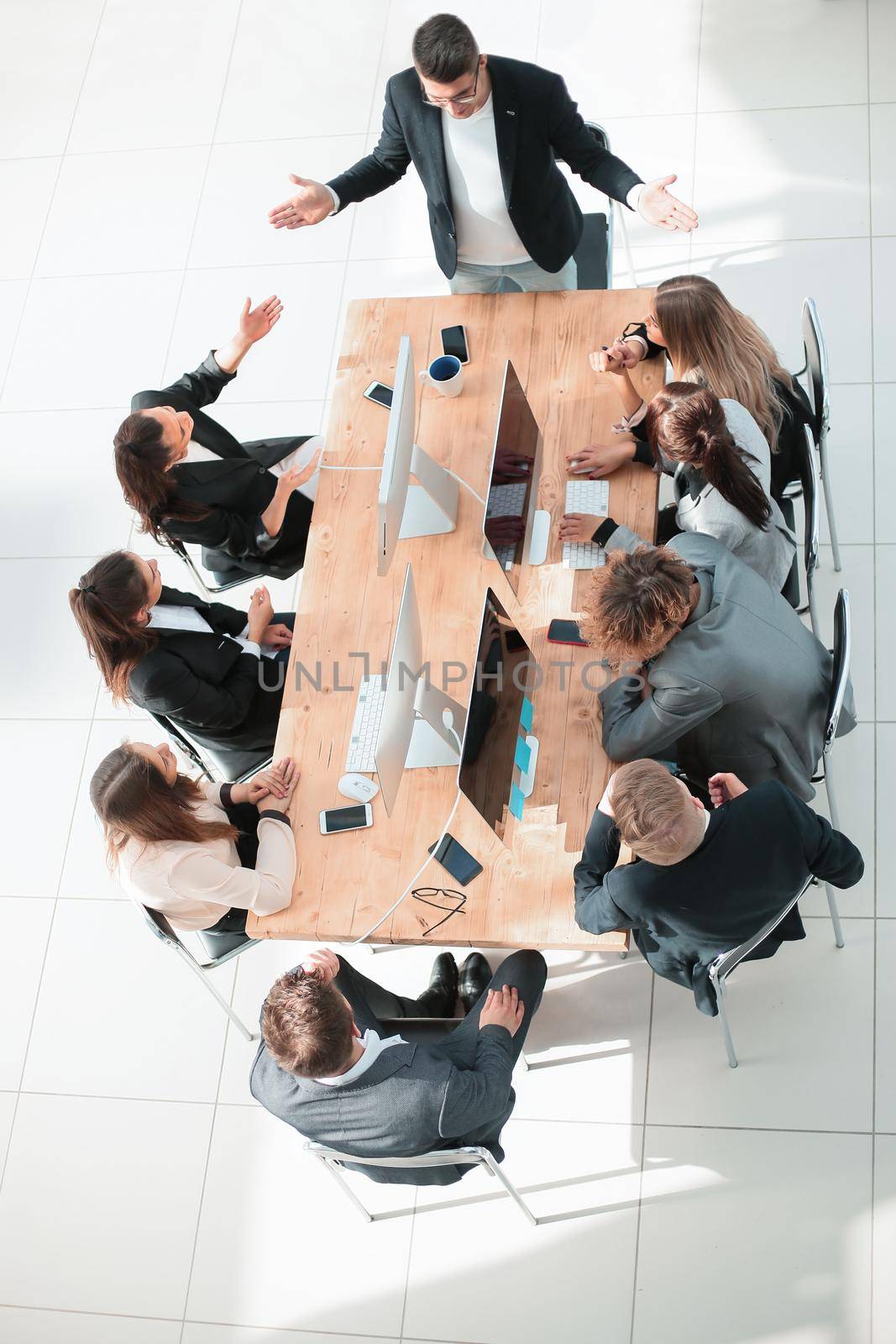top view. business team applauding at a work meeting . the concept of successful work