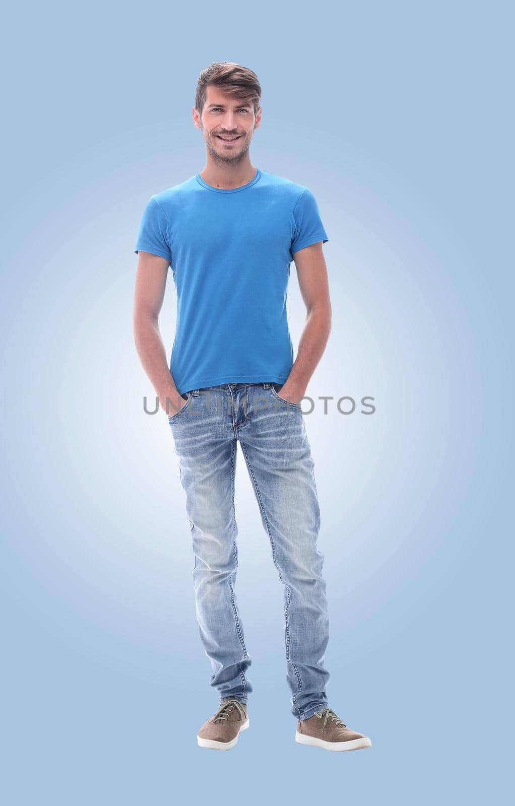 in full growth. confident young man in jeans. by asdf