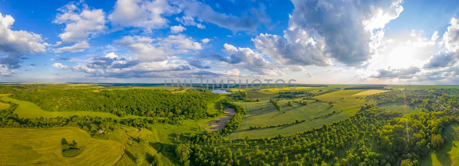 Amazing aerial panorama from the drone of beautiful fresh green countryside at summer by EdVal