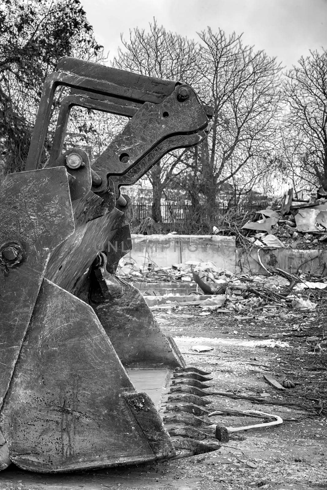 Black and white vintage view of big shovel of excavator after work in construction site