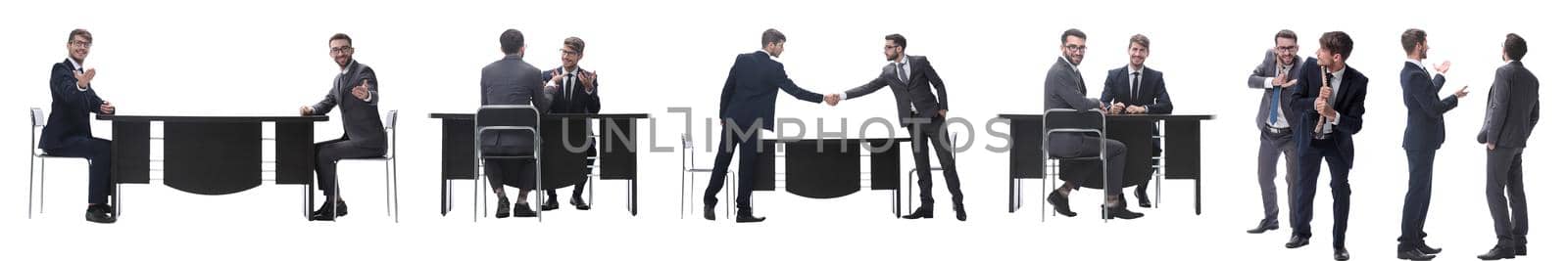 in full growth. two business people discussing something. isolated on white background